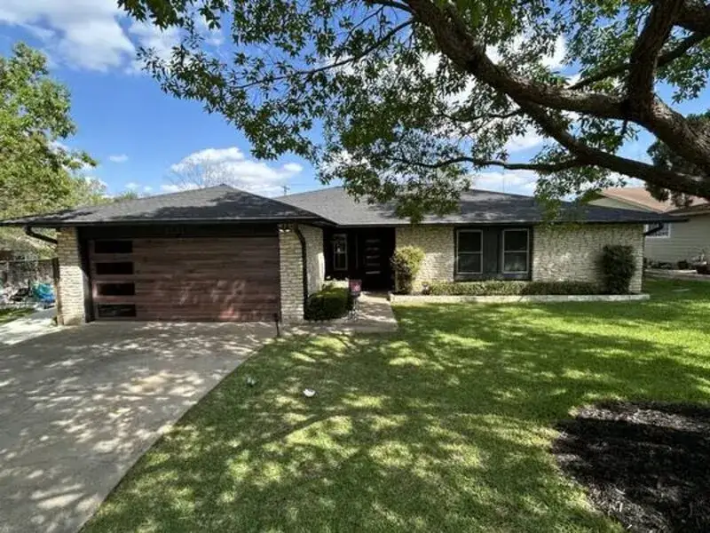 Full house exterior after painting — modern charcoal trim by V&S Services Austin