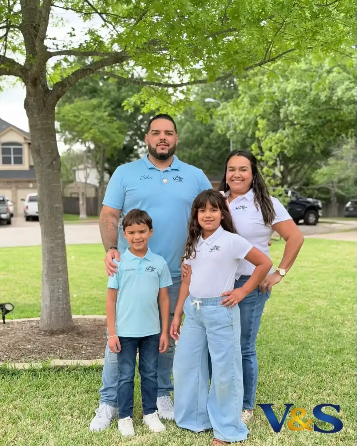 Julio Diaz, owner of V&S Painting & More, with his wife Tess and their two kids