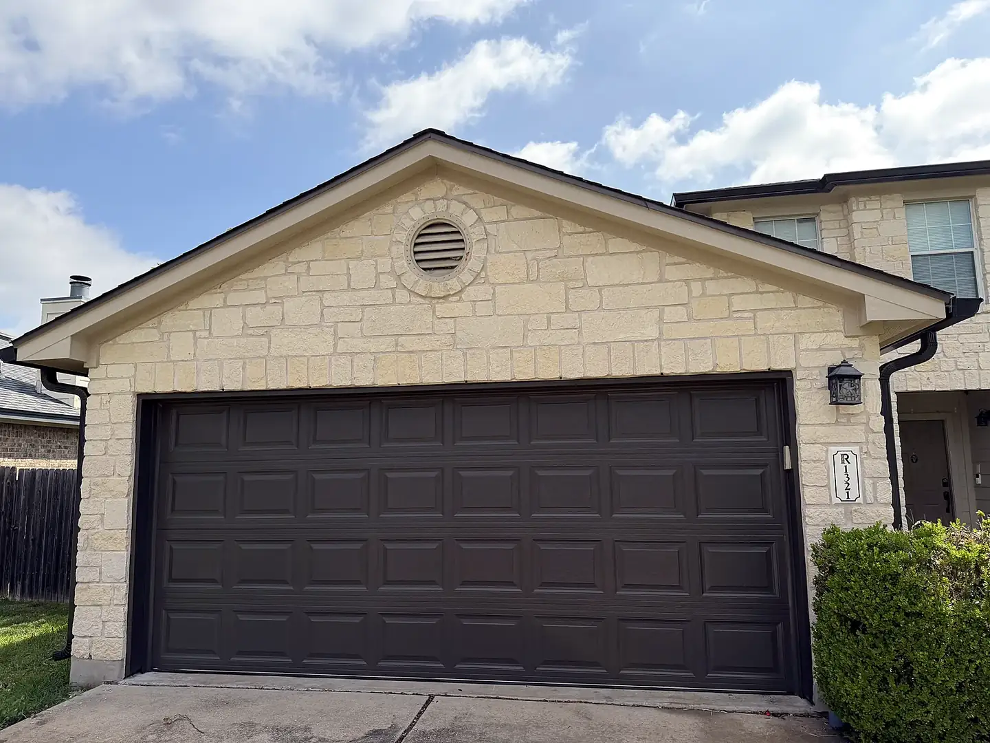 After: Garage door refinished from cream to charcoal in Pflugerville, TX