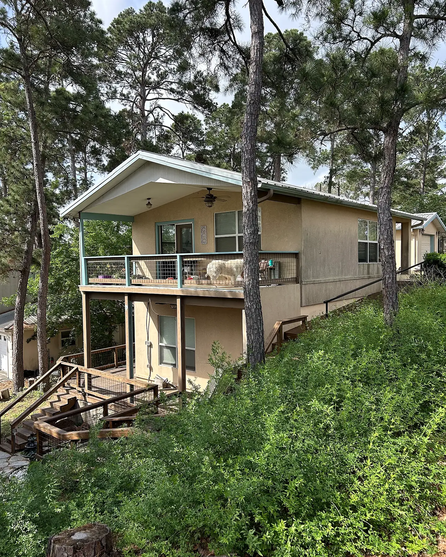 Before: Hillside home after a full exterior repaint in Pflugerville, TX