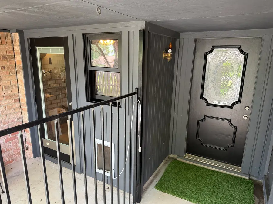 Same entry after, doors and trim refinished charcoal by V&S Painting, Austin