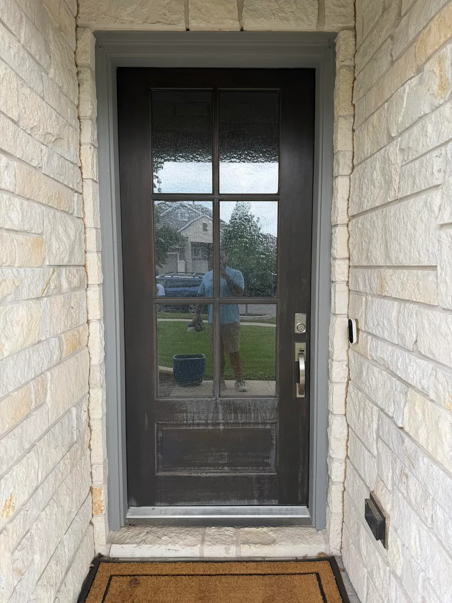 Front door before refinishing, faded black with grimy glass, Austin