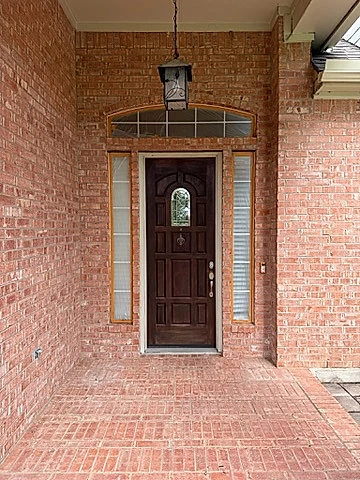 Front entry before painting, natural red brick, Austin