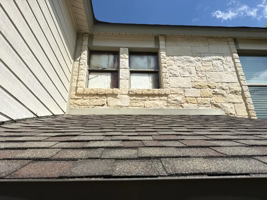 Second story window trim and fascia repainted by V&S Painting, Austin