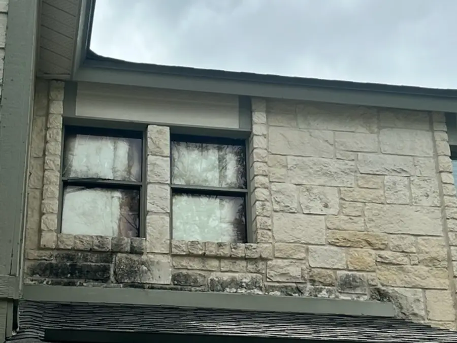 Second story stone and window trim before painting, weathered, Austin TX