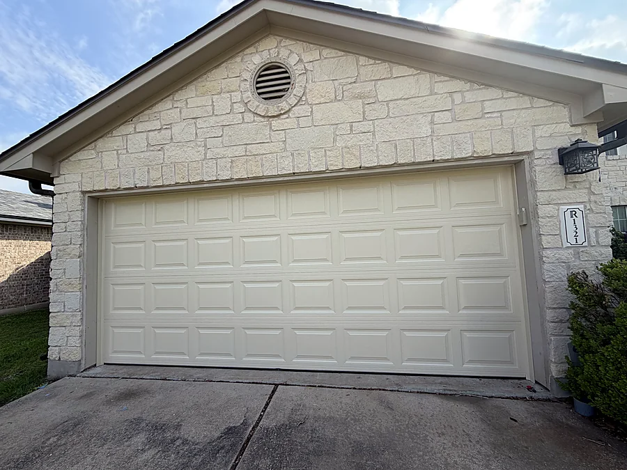 Cream garage door before painting, Austin