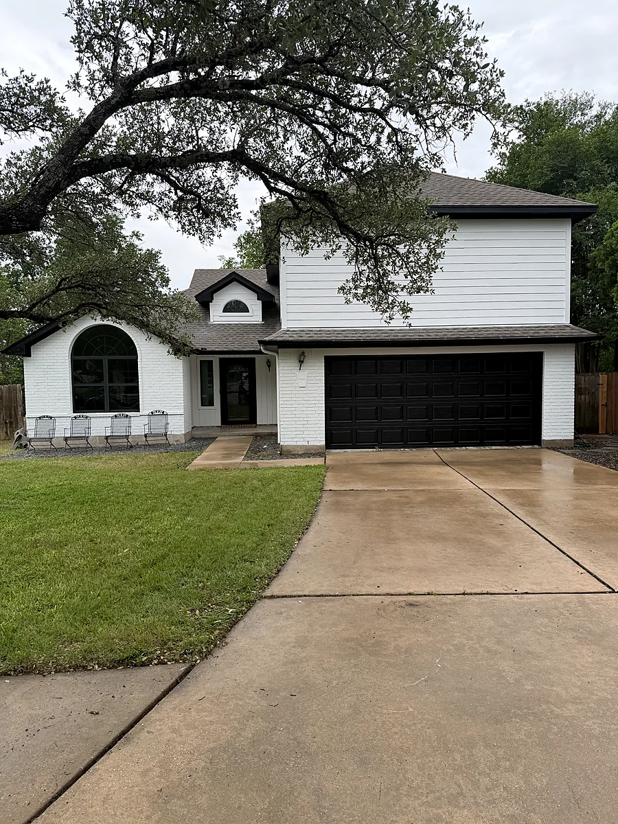 Same two story Austin home after, painted bright white by V&S Painting